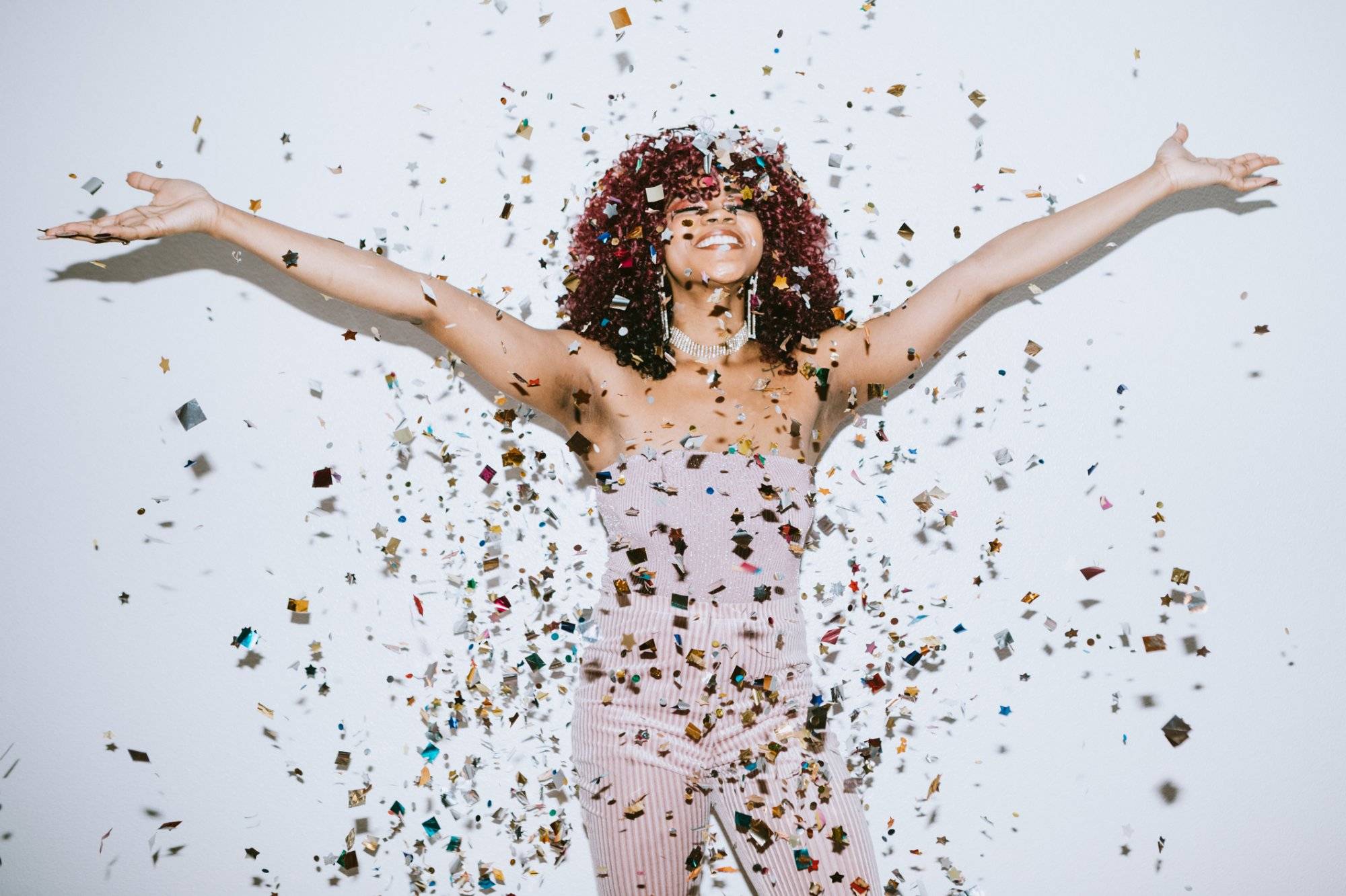 Generation Z Young Woman Celebrates With Confetti Generation Z Young Woman Celebrates With Confetti